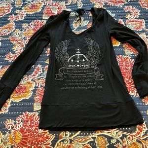 Cute black long sleeve shirt with jewel embellishments.